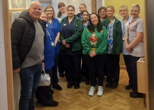 Paul and Jane visit the Macmillan Unit at CRH to share their latest donation amount 