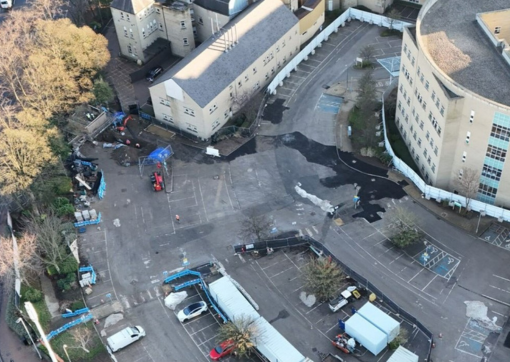 An image of the car park from above taken by a drone, which shows where the enabling works were carried out with darker tarmac