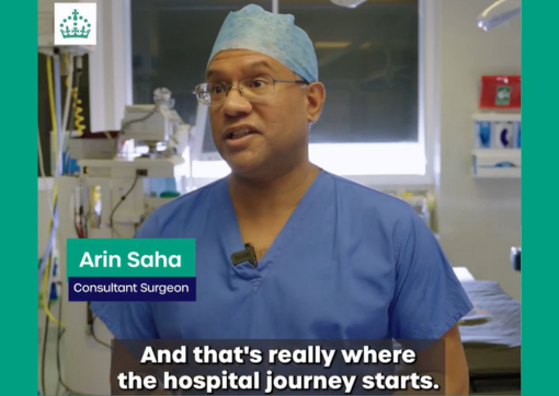 A screenshot taken from the film of consultant Arin Saha in his green scrubs in theatre 