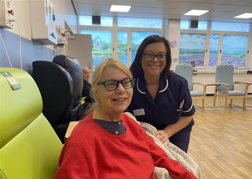 Marguerite Eccles, pictured with Ward Manager, Kath Stubbington sat in a recliner chair waiting to leave the discharge lounge