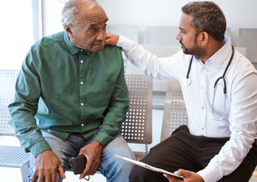 A doctor talking to a bereaved relative