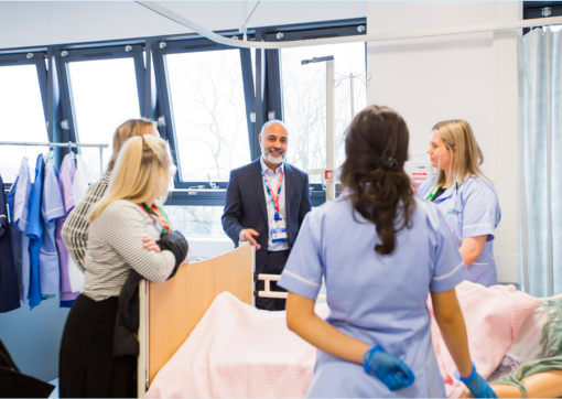 Our Medical Director with some students in the mick ward at the college