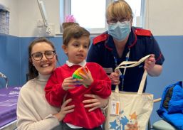 Amanda pictured with a patient Jack and his mum Sammy 