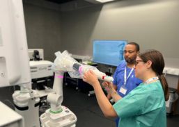 A group of surgeons being trained to use the next generation Versius robotic system